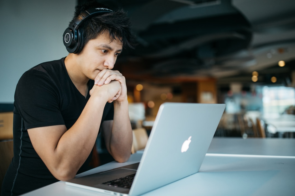 men watching laptop